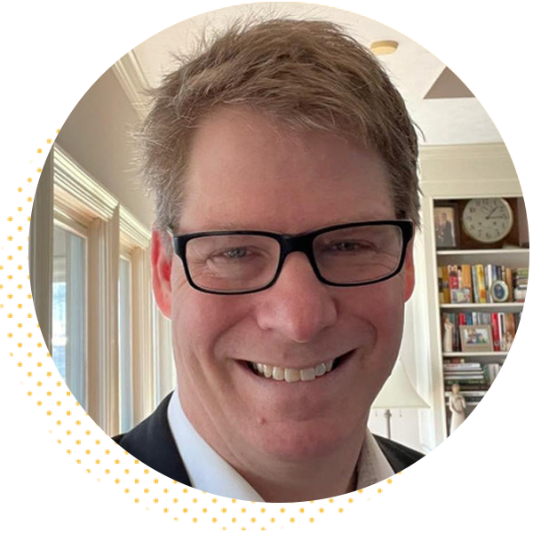 Smiling man with glasses in a home setting, featured on the 